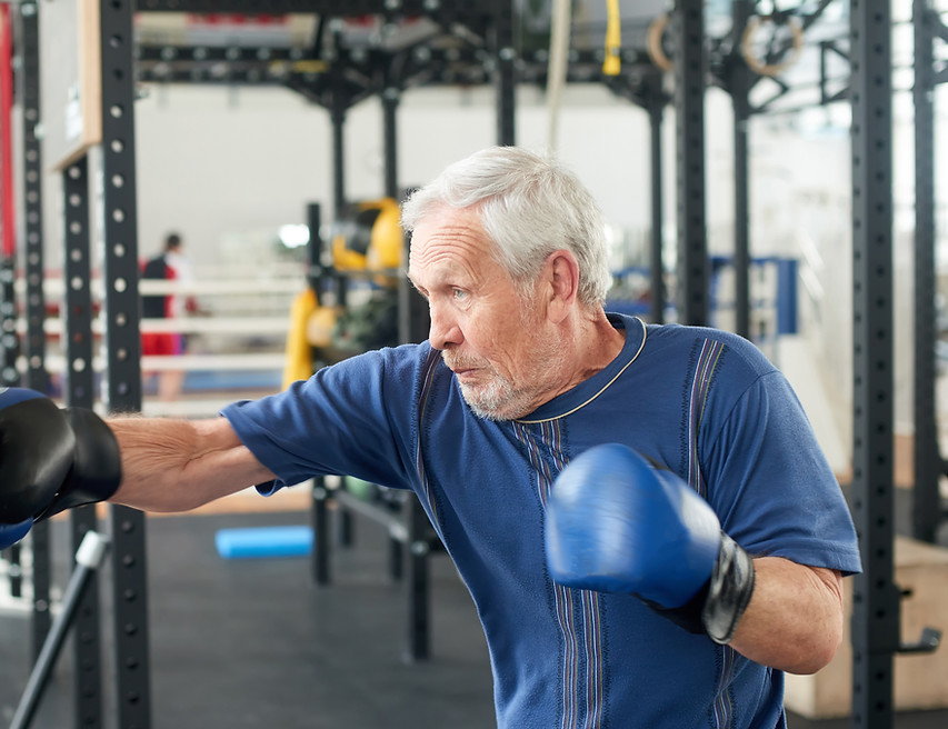 Elderly man enjoying his fitness class 