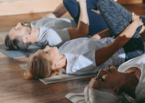 People stretching on mats