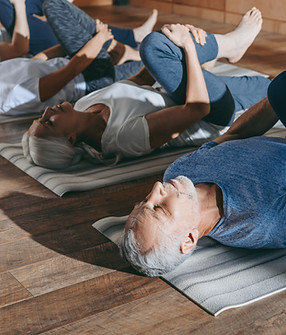 People stretching on mats