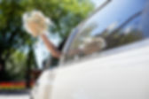 Bride Waving Flowers in Limo