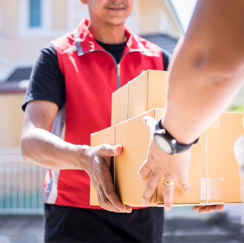 parcel delivery man of a package through a service and customer hand accepting a delivery