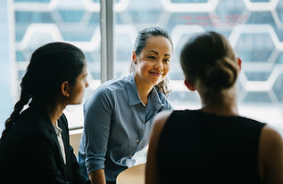 Three women in business connecting and having a discussion