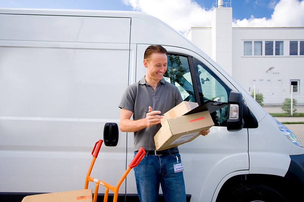 Delivery driver carrying boxes wearing custom embroidered navy polo shirt