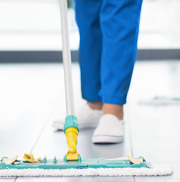 cleaner mopping office floor