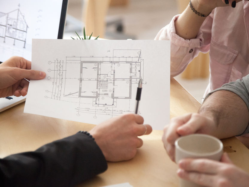 Reviewing architectural floor plans for a custom home in Denver