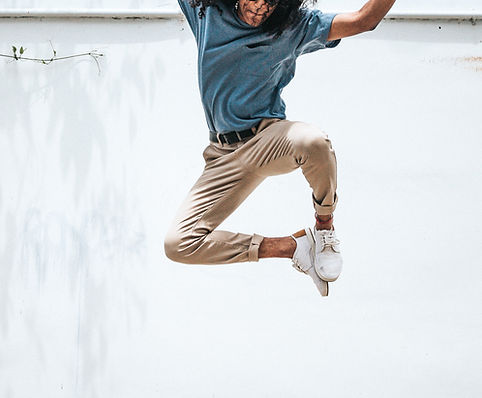 Person jumping with joy celebrating success from Onpoint Media’s effective advertising campaigns