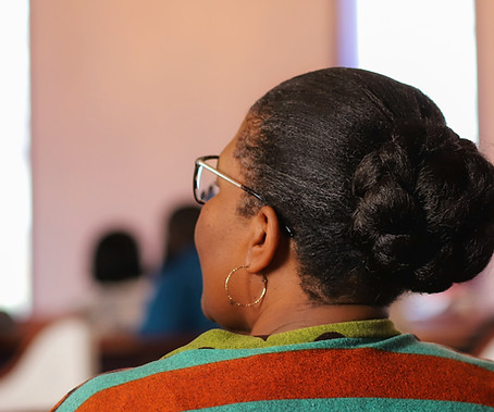 Woman in Church Pews