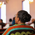 Woman in Church Pews