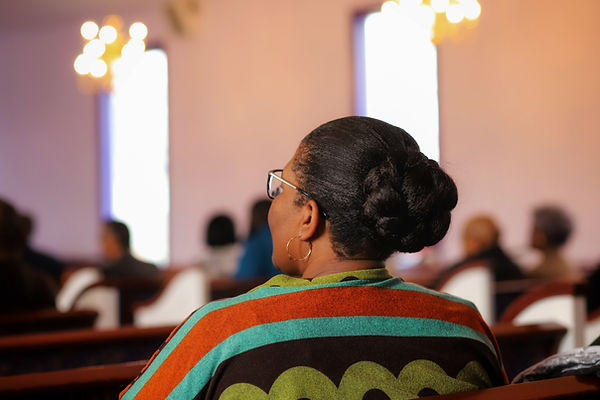 Woman in Church Pews