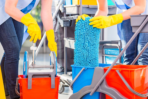 Cleaning ladies mopping floor, close up on hands and tools