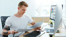 Graphic designer working at his desk.