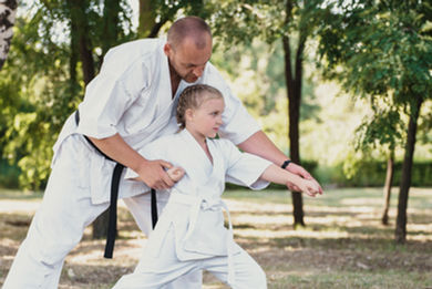 Instructor training student outdoors.