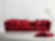 A red leather sofa in a classic interior setting