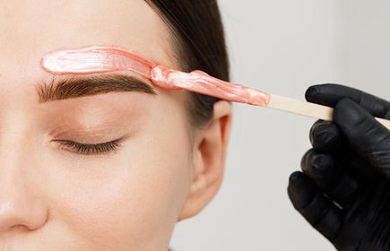 Eyebrow waxing process to shape and define brows