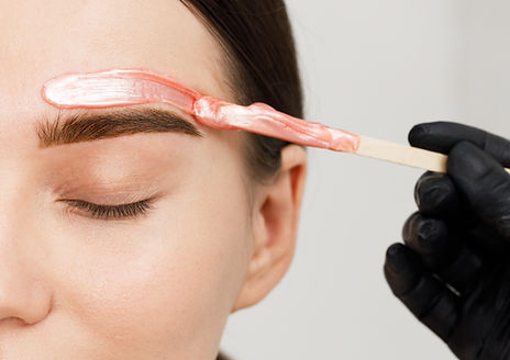Brow waxing - precise hair removal to shape and define eyebrows for a clean, polished appearance.