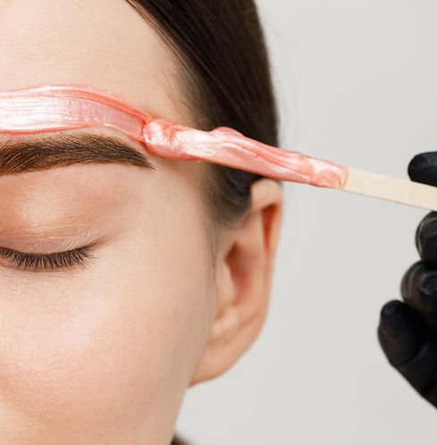 Client getting their eyebrows waxed in Woodland Hills, CA.