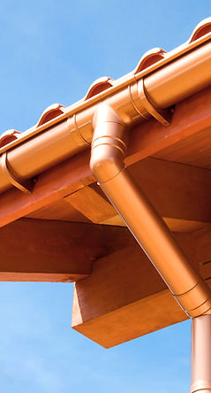 Photo of a roof and the gutter system that's attached to the house