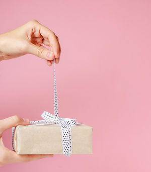 Unwrapping a gift card in a gift box