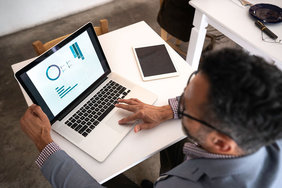 A person using a laptop in an office environment