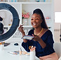 Beauty Vlogger doing her makeup while creating a video