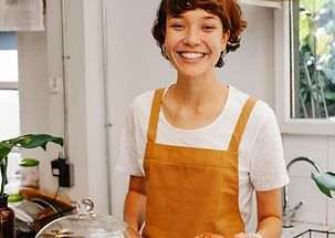 Smiling barista with croissant