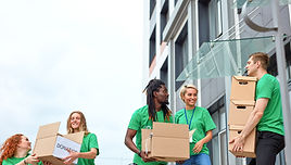 Volunteers Carrying Boxes