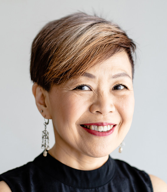 An older female executive smiling