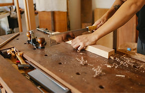 Carpenter Sawing Wood