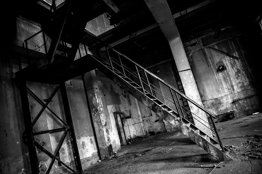 Abandoned industrial interior with stairs