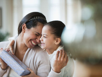 Mom and daughter with present