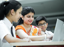 A teacher teaching students in a digital classroom