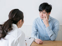 photo of someone talking to their doctor