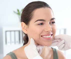 Female having her face analysed by the practitioners at Dani Louise Aesthetics during consultation