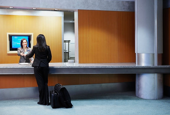 Hotel clerk assisting customer