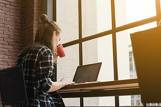 A person sitting at a desk with a computer