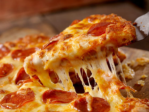 Cheesy pizza slice with melted mozzarella stretch