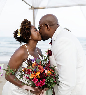 Beach wedding couple kissing
