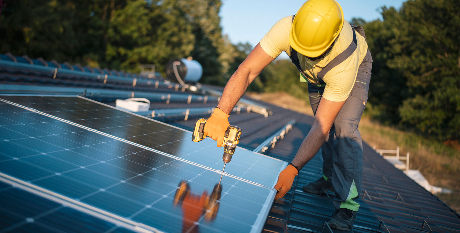 Installing solar panels — green-energy work for Veterans
