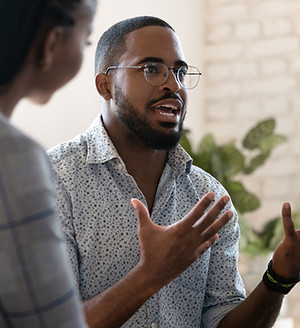 Man Speaking at Support Group