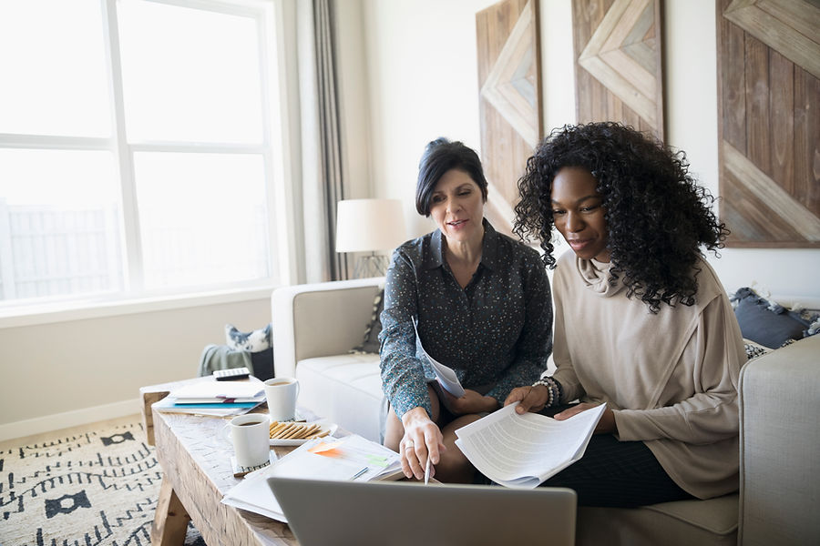 Financial advisor with laptop and paperwork