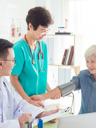 A doctor examining old patient