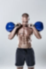 Man Holding Kettlebells