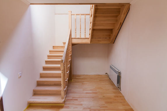 New wooden staircase in the interior of a private house