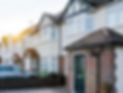 Houses and gardens in Paignton UK, suburban streets and driveways at sunset