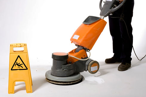 cleaning the floor with a machine