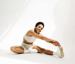 Woman stretching in matching fitness outfit