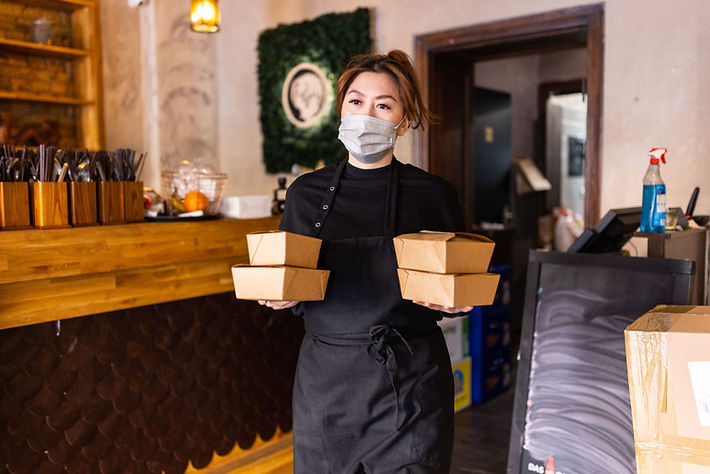 Asian woman carrying takeaway food packets for delivery