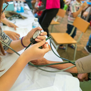 Asian doctor measure blood pressure for a man