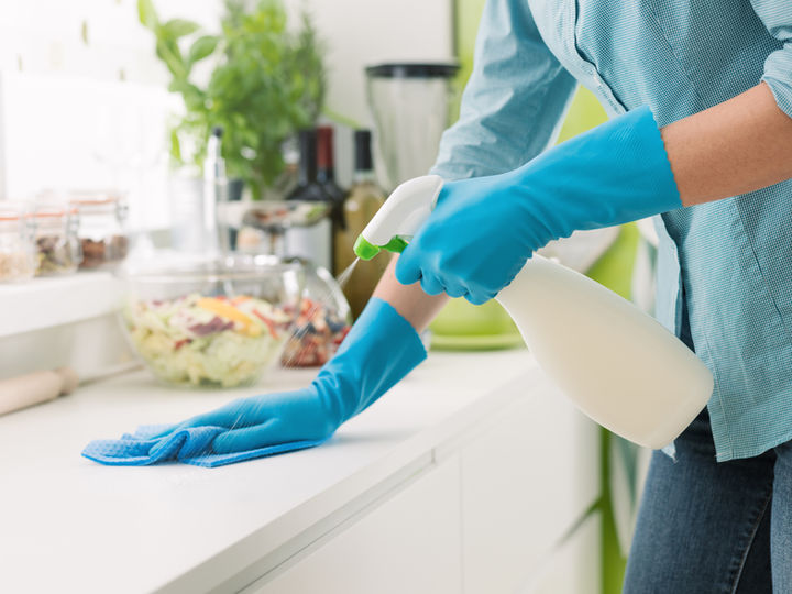 Housekeeper cleaning kitchen