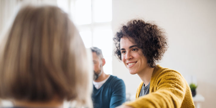 Person offering supportive guidance, symbolizing mental health support in the workplace
